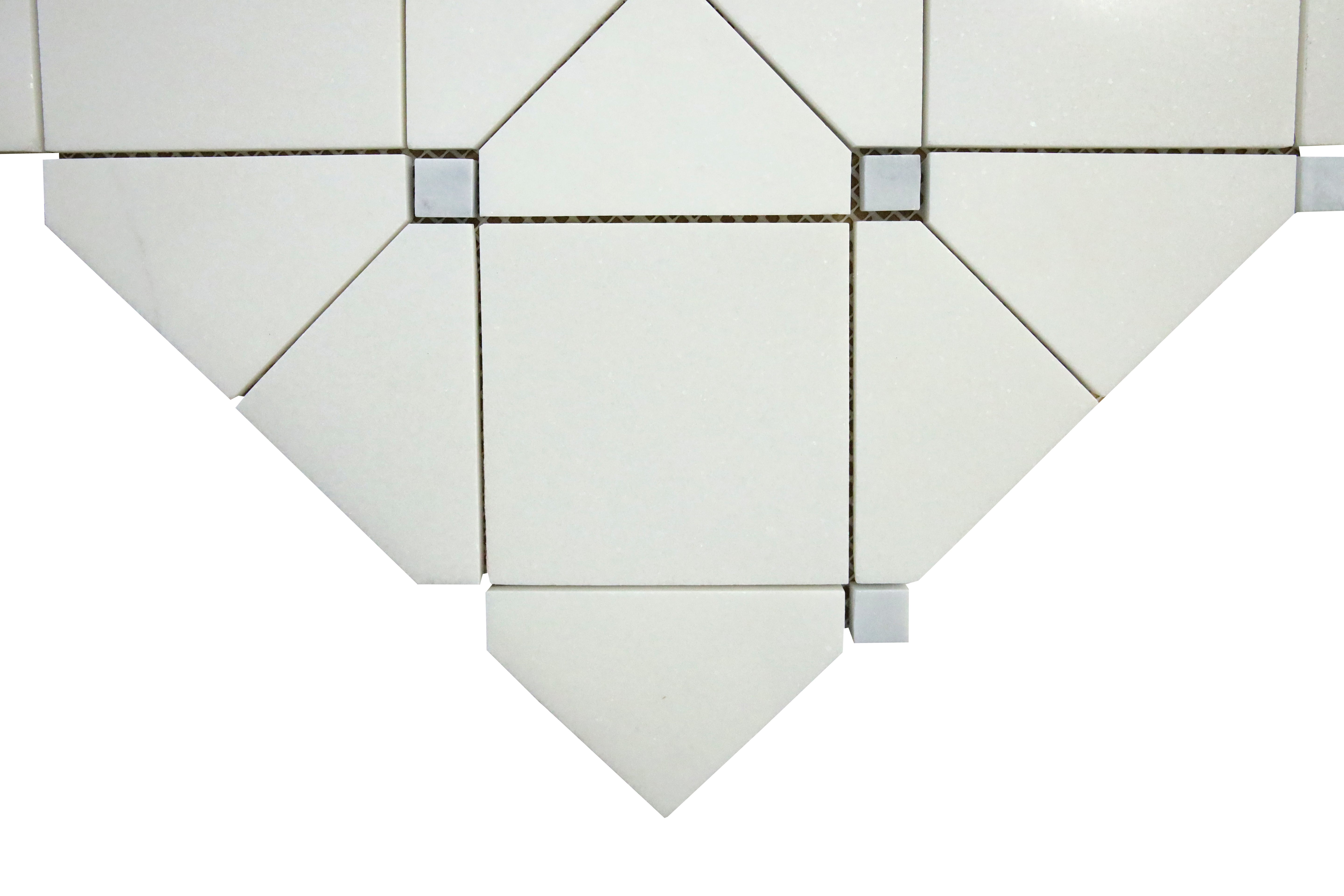 Close-up of Mona Thassos marble mosaic showing grey accent dot detailing
